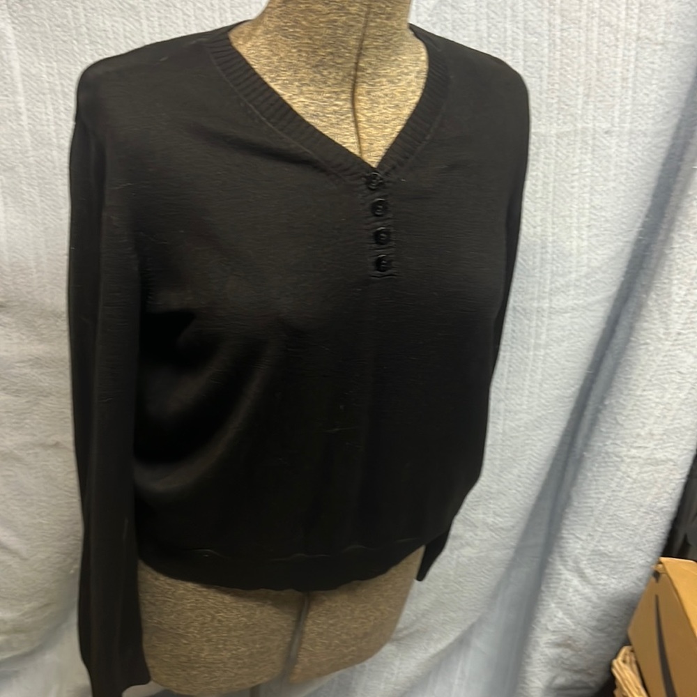 Ladies black pull over top sized large but appears to be more of a size medium